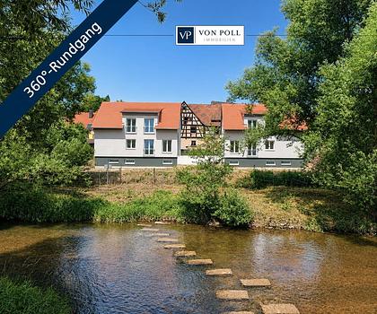 Wohnen am Fluss: Modernes Neubau-Massivhaus in begehrter Uferlage mit Panoramablick